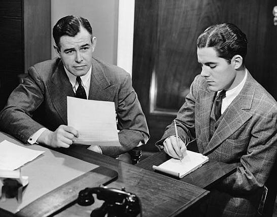 Male stenographer taking dictation